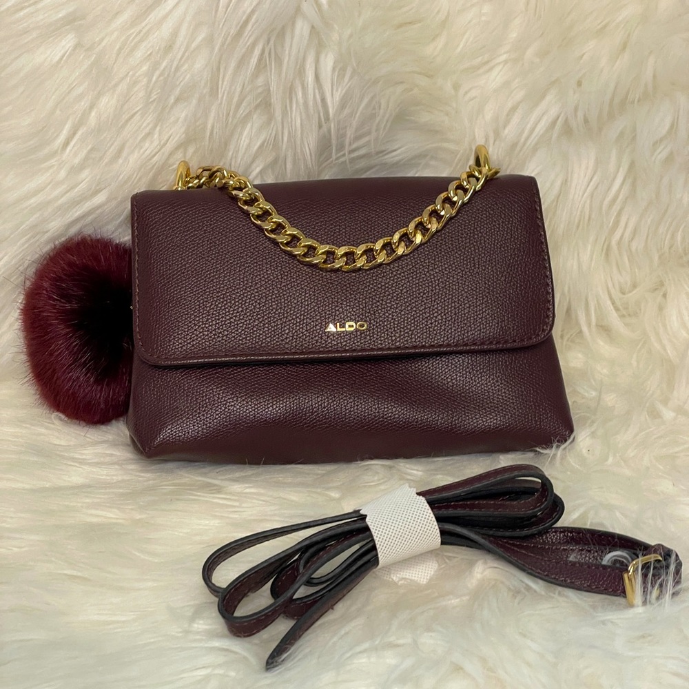 Aldo Mini bag with matching charm and strap. Burgundy